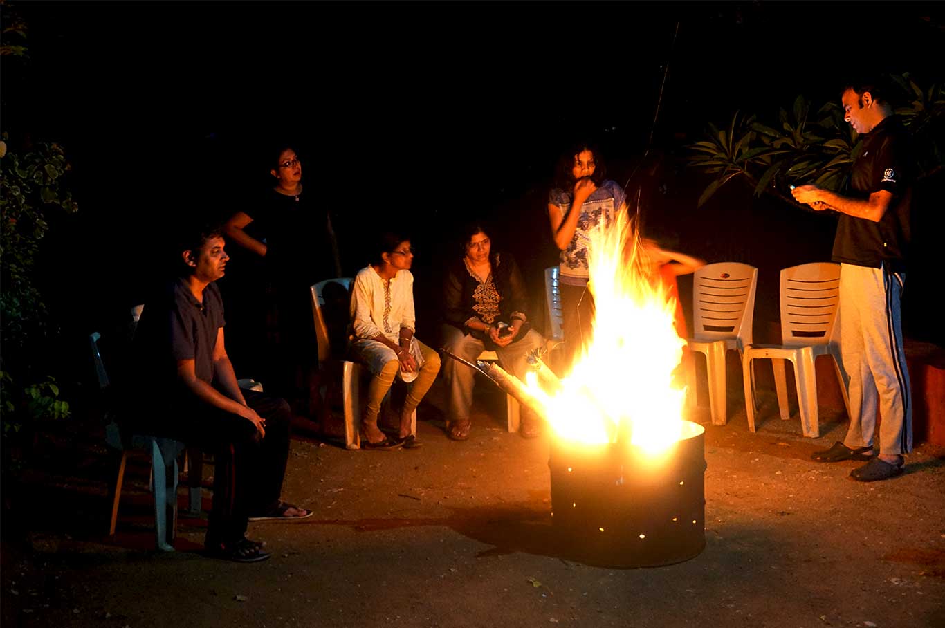 A Family enjoying the night at the fire camp