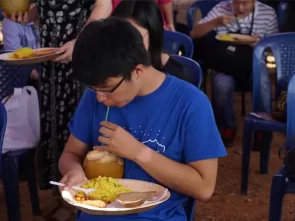 international-guests-relishing-organic-food-with-fresh-tendercoconut