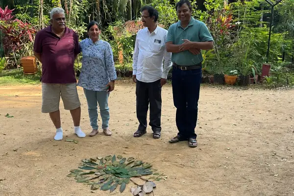 Family Creating Nature Rangoli at Eco Stay
