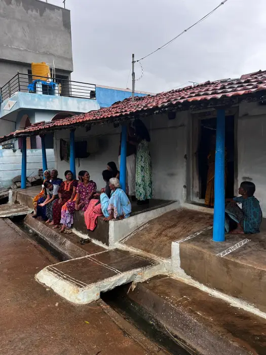 Visitors Walking Through Traditional Village Lanes in Belakavadi