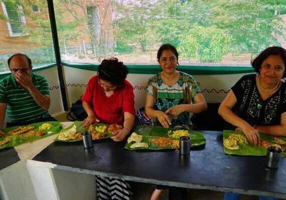 Guests-Enjoying-Village-Traditional-Food-at-Chukkimane