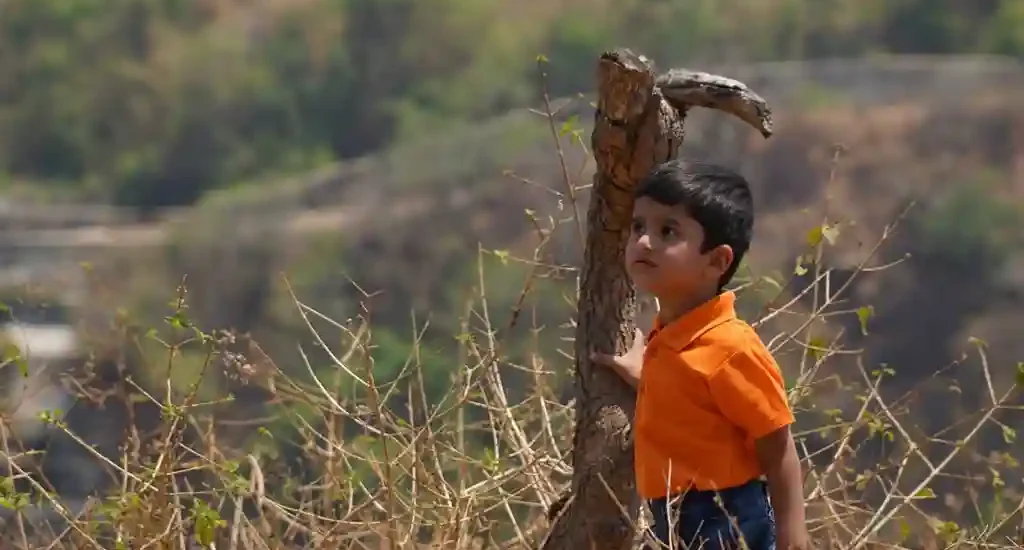 A kid exploring the landscape around Chukkimane