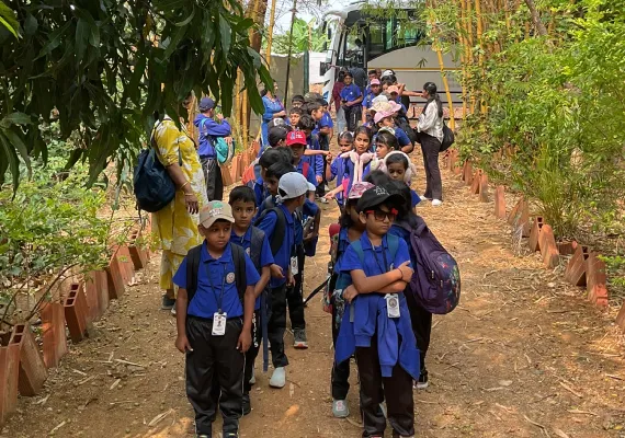School students participating in seed ball making activity