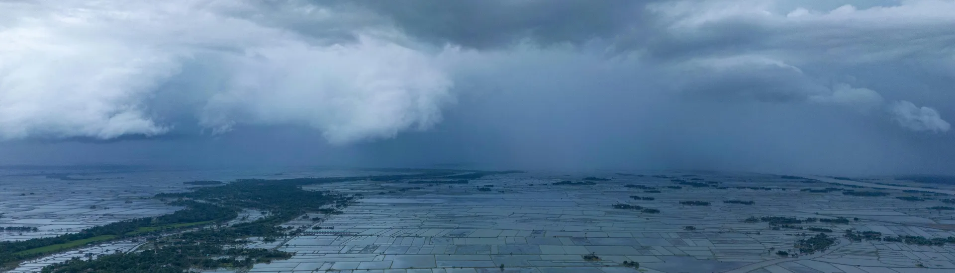 Dark monsoon clouds bringing rain over Karnataka farmlands Dark monsoon clouds bringing rain over Karnataka farmlands