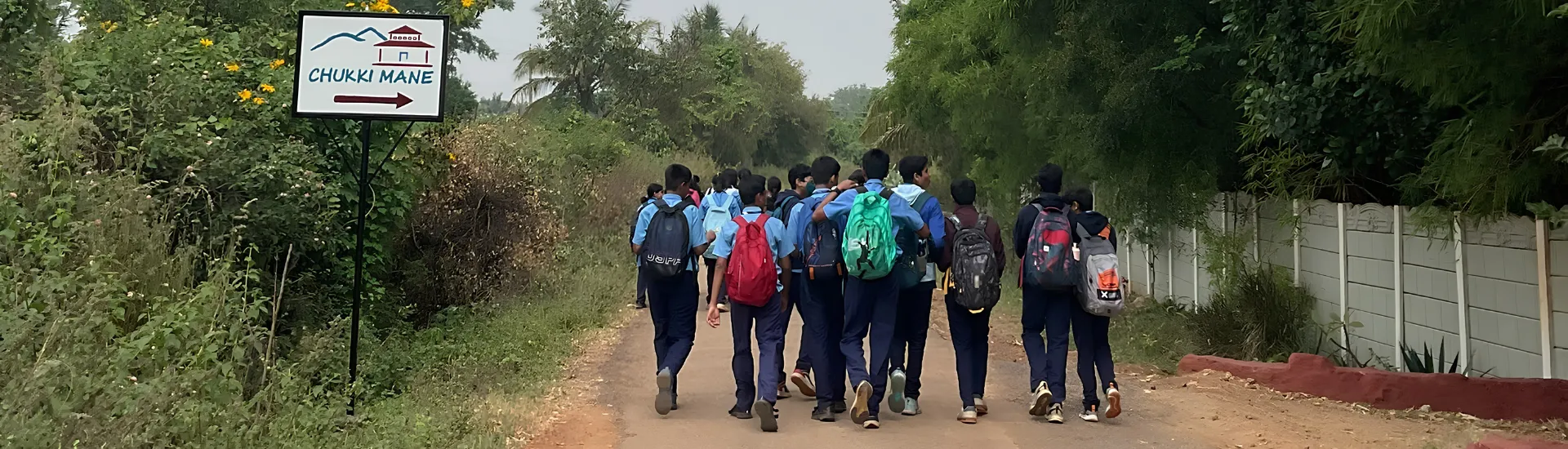 School students walking towards ChukkiMane for an immersive outdoor learning experience