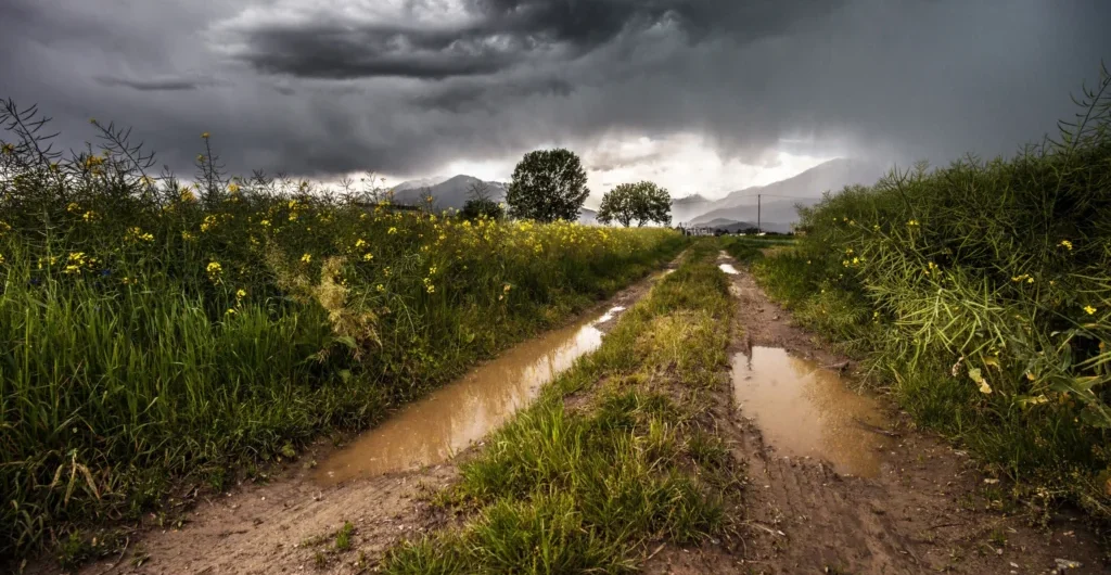 Storm clouds over green rural farmland Storm clouds over green rural farmland