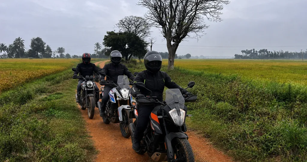 Bikers riding through Karnataka countryside near ChukkiMane