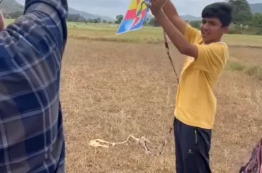 Child learning traditional kite flying at ChukkiMane