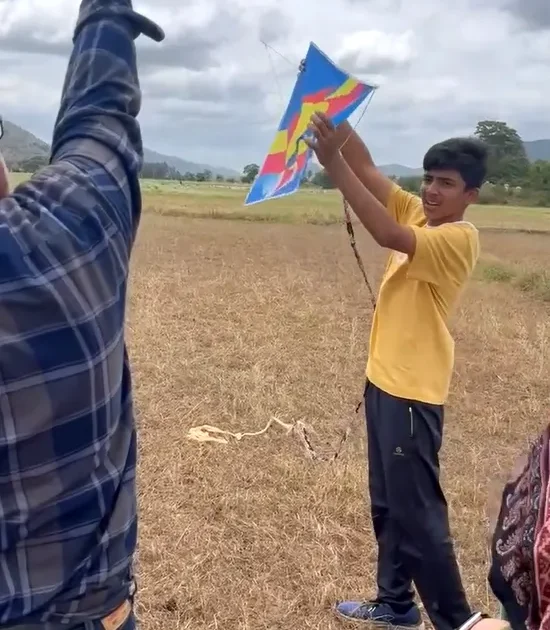 Child learning traditional kite flying at ChukkiMane