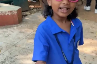 Child proudly holding a handmade seed ball at ChukkiMane