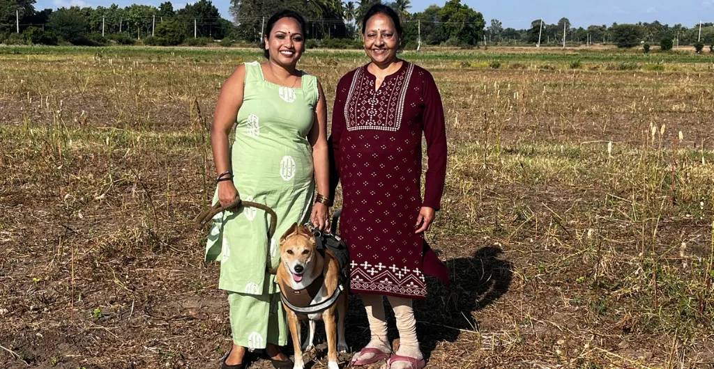 Chukki the dog enjoying a farm visit with her family