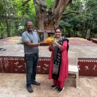 Mr Sanjay gifting organic papaya to visitors