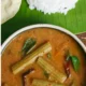 Sambar with rice on banana leaf