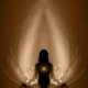 Woman meditating in a peaceful natural setting for relaxation and wellness
